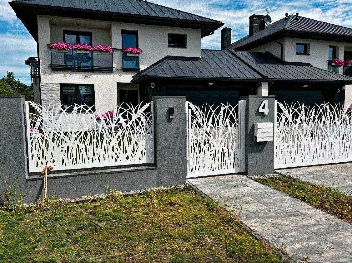 Modern house with decorative white fence and number 4 on a clear day